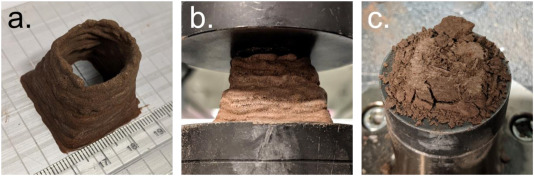  Visible light images of the 3D-printed HSA-ERB based on Martian Global Simulant. (a) after fabrication, (b) during compression testing, and (c) after compression testing.