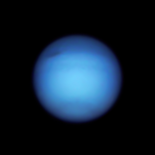 On Sept. 7, 2021, Hubble captured Neptune's darkened northern hemisphere, along with its dark spot storm, which has moved around the planet since it was first spotted by the space telescope in 2018.