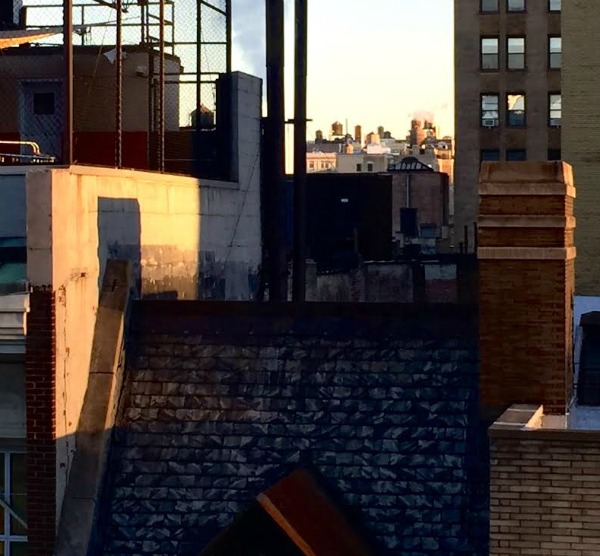 City building tops with shadows.