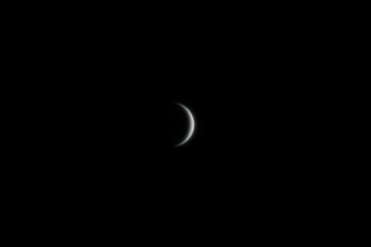 venus appears as a fuzzy crescent against black background.