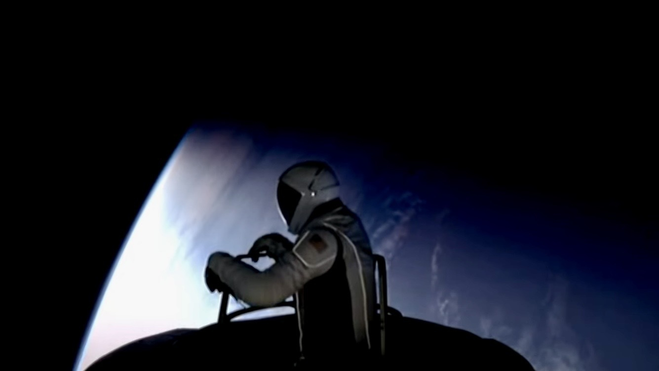 A spaceman pops out of a spacecraft above earth