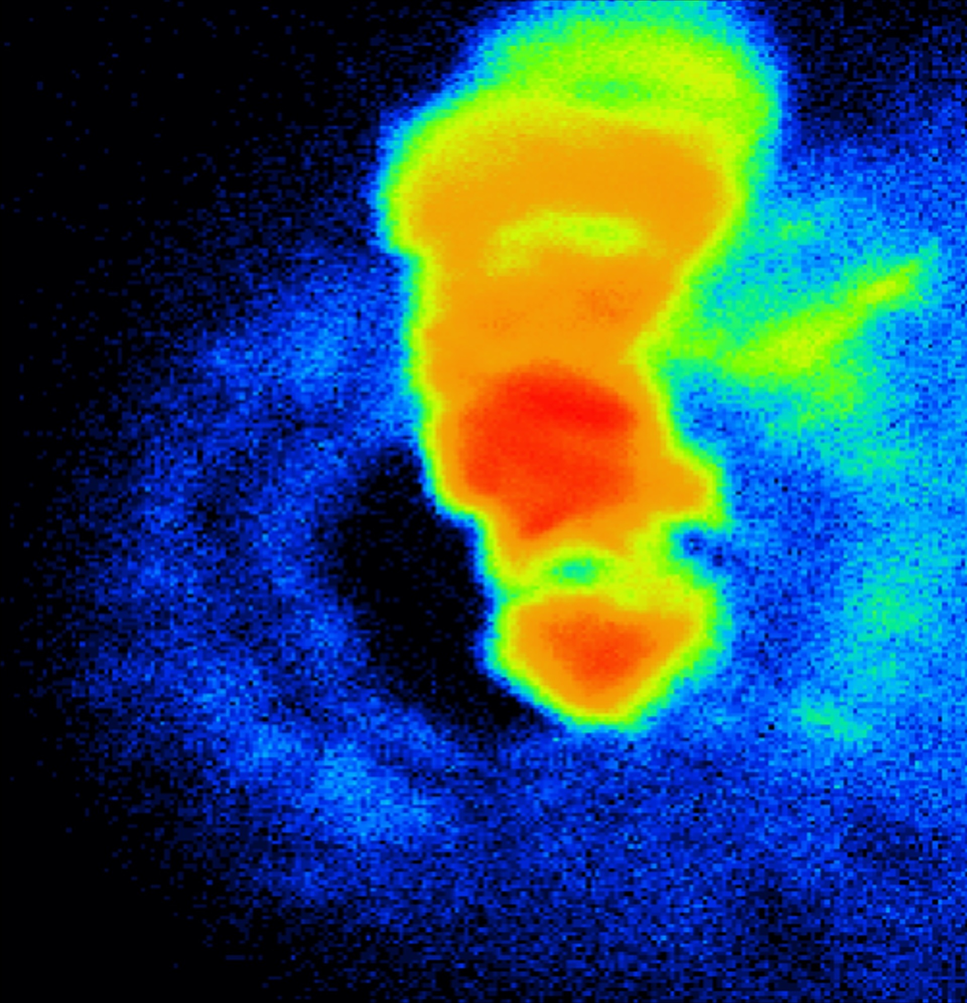A heatmap style image showing an iron sample heated up, with red in the middle and blue around the outside.