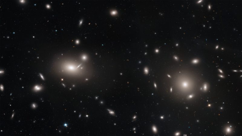 Black background with large ovals of Airy and smaller points and smudges.