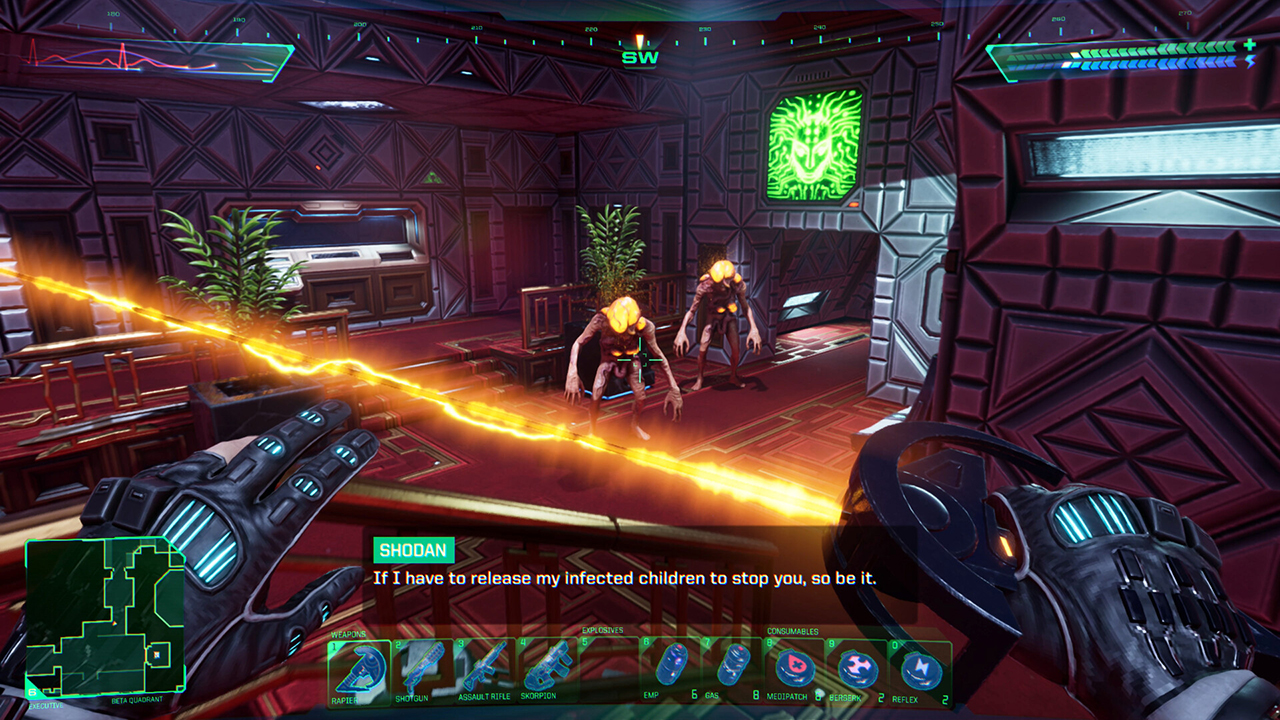 A Primary-person screenshot of the System Shock remake, showing our protagonist's hands holding an energy weapon as they face down two mutant enemies.