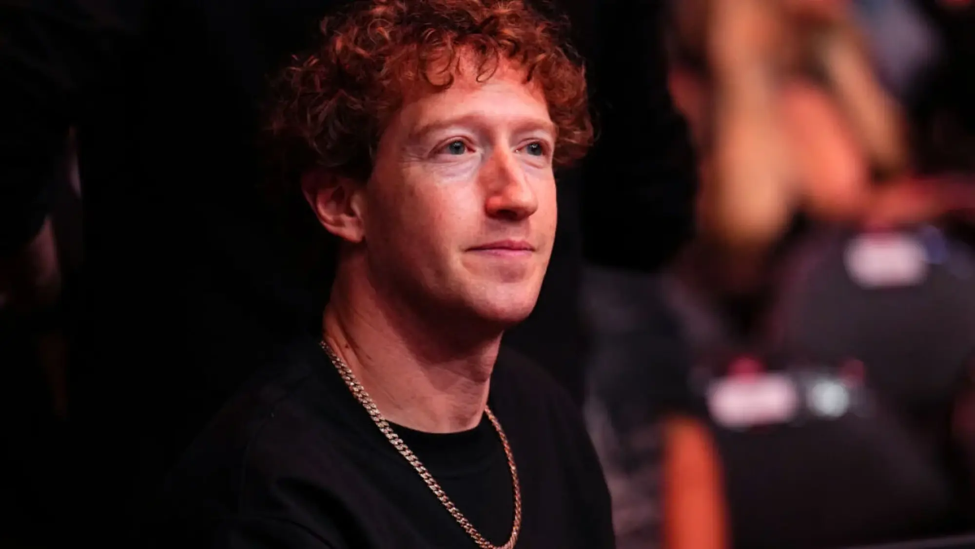 mark zuckerberg in black t-shirt with gold chain
