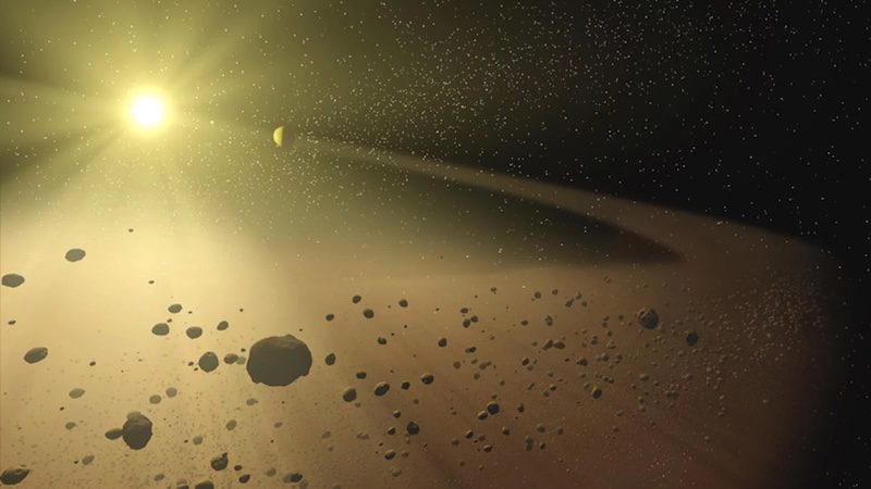 Solar system objects: Collection of many small rocky objects orbiting a bright star.